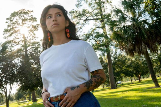 Ashley Solis is posing for the photo.